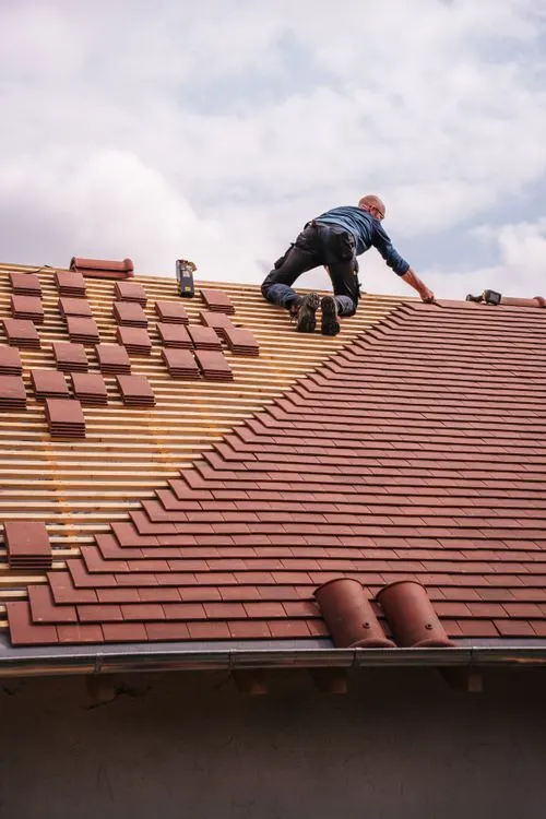 Roofer installing a residential roof